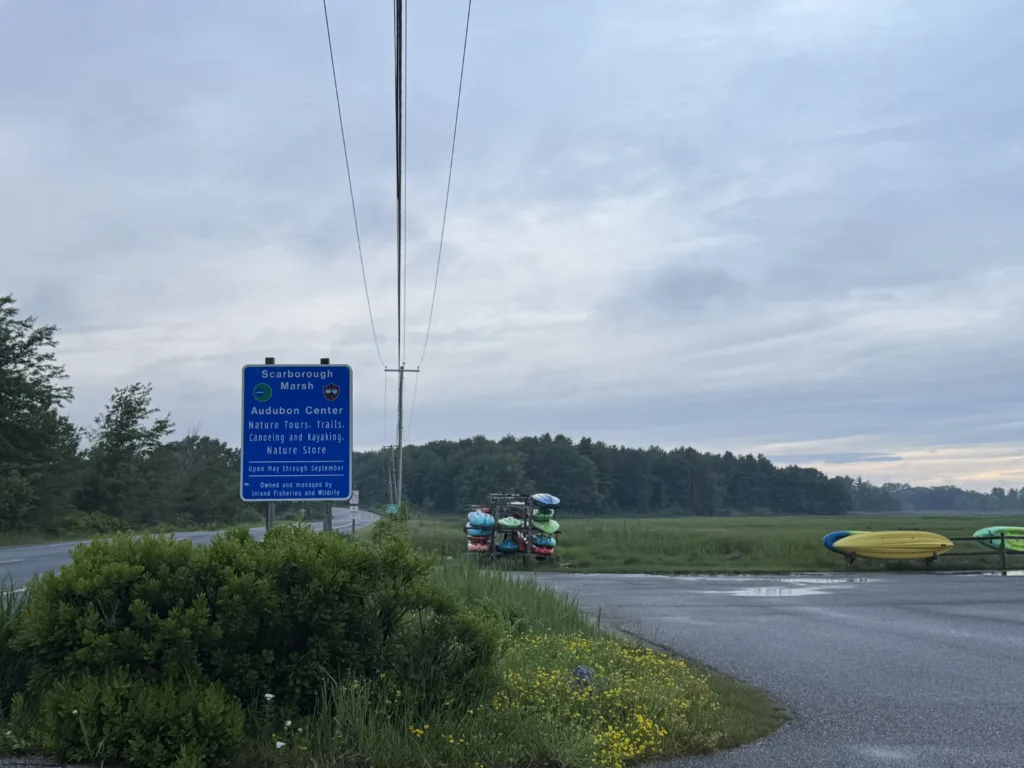 Tried and True medical cannabis delivery vehicle route near the Scarborough Marsh Audubon Center sign for nature tours and trails.